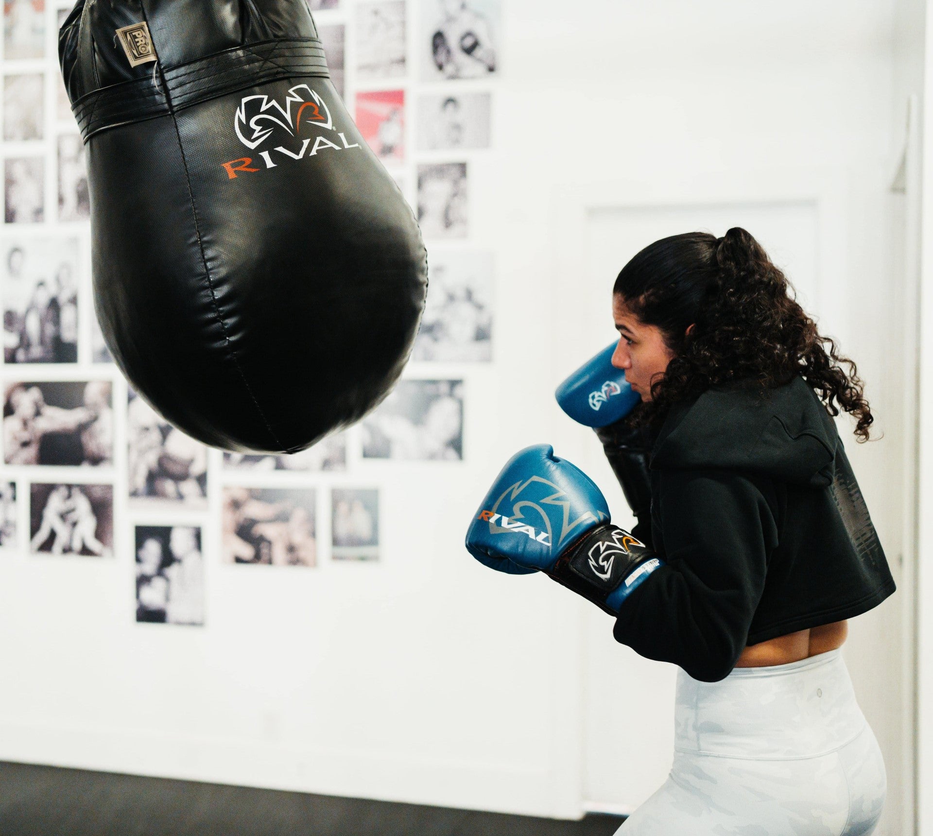 Punch Tracker Boxing and Heavy Bag with Boxer Using POWA Punch Sensors