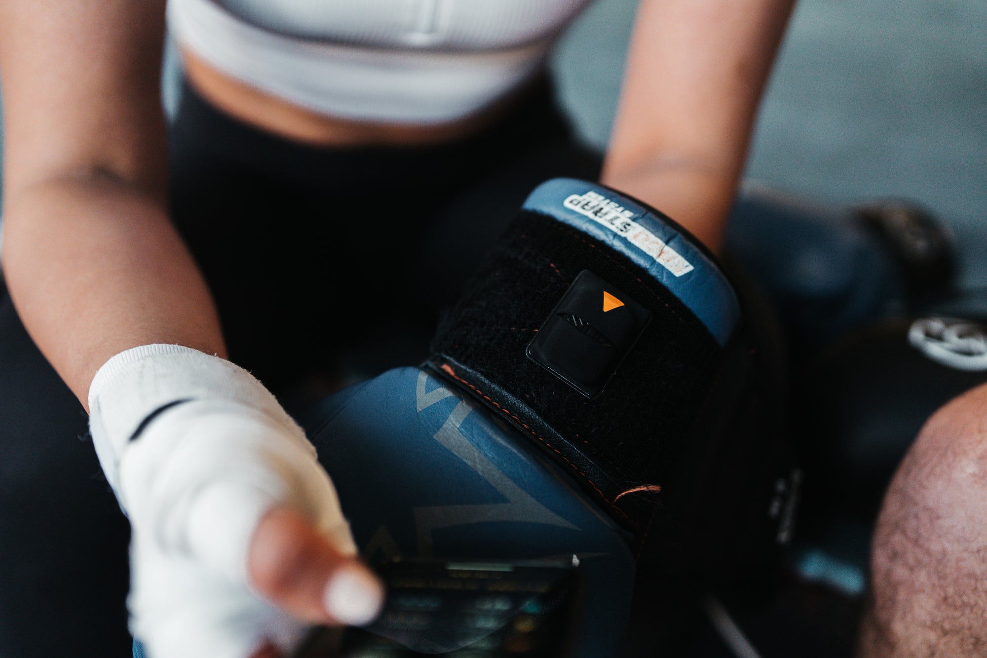POWA Boxing Sensors Attached to Gloves Via Velcro Pouch